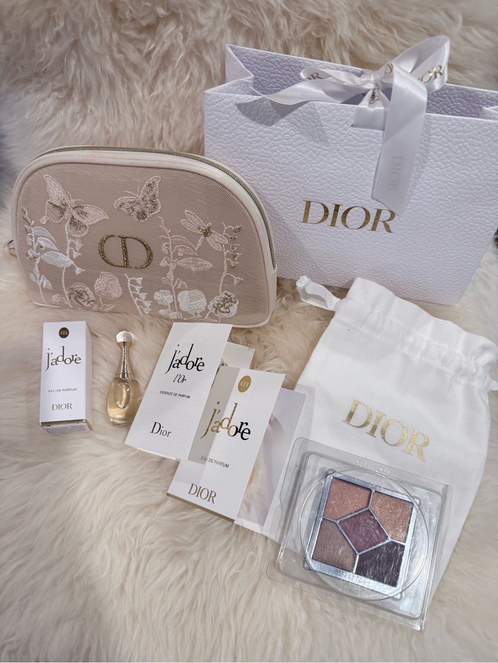 Dior Embroidered Beige Cosmetic Pouch with perfume samples and eyeshadow tester